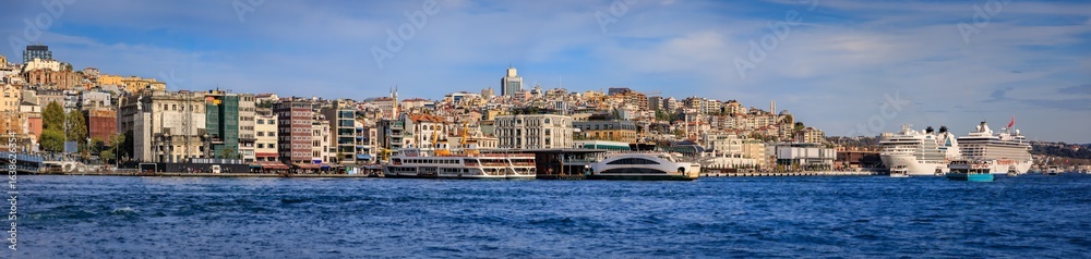 Obraz premium A modern Galata Port neighborhood overlooking the Bosphorus in Istanbul, Turkey