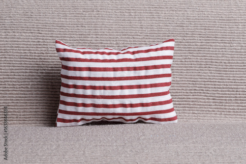 Red striped pillow on the sofa
