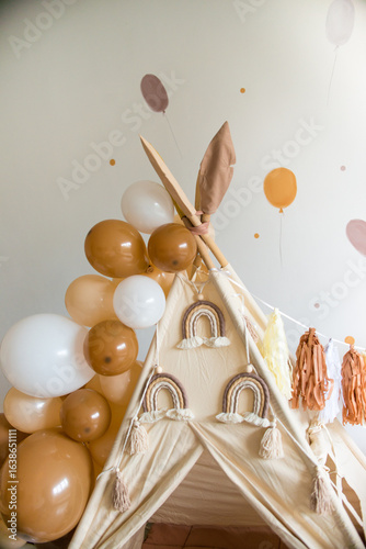 teepee and balloons birthday in boho style with rainbows