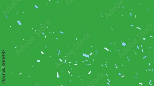 Light blue and white confetti falling in front of green screen.