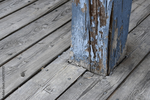 Old wooden deck beam. Roi and decay from outdoor abuse.