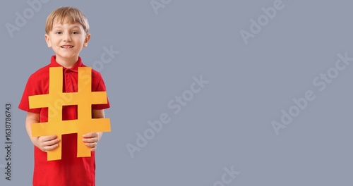 Cute little boy holding has...