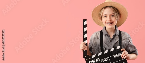 Little actor holding movie ...