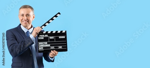 Mature actor holding movie ...