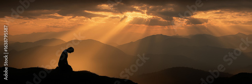 Silhouette young man worship beneath night galaxy prayer faith hope banner.
