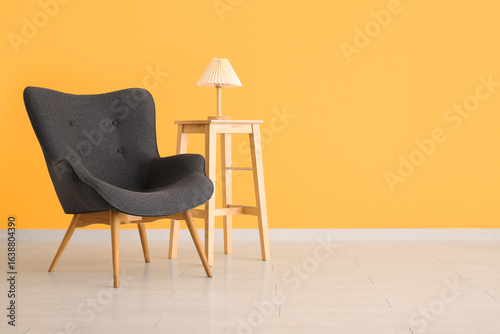 Modern gray armchair and wo...