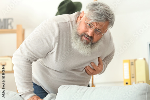 Elderly man having heart at...