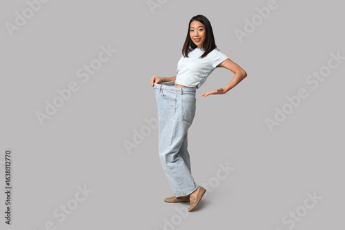 Beautiful young happy Asian...