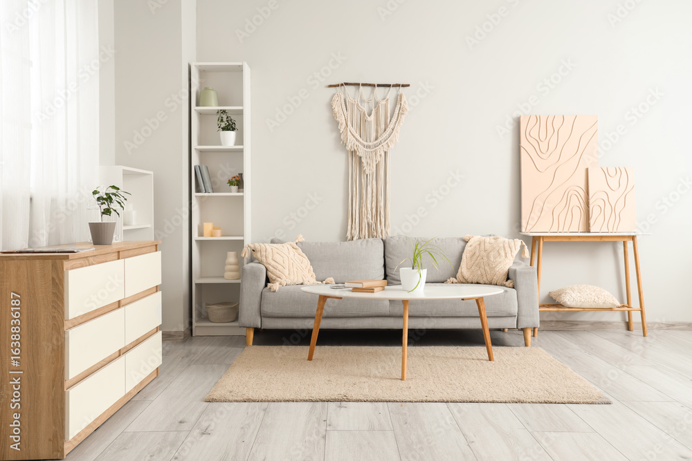 Obraz premium Stylish sofa with table in living room