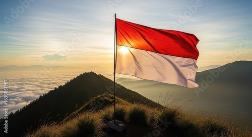 National flag waving on mountaintop sunrise