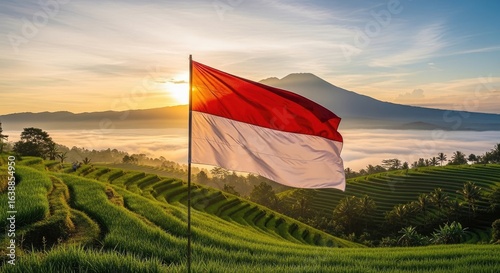 National flag waving over rice terraces at sunrise