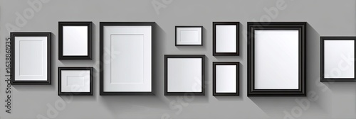 Multiple black picture frames of various sizes on a gray background
