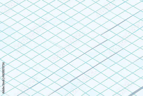 Close-up of light-blue gridded paper with faint lines