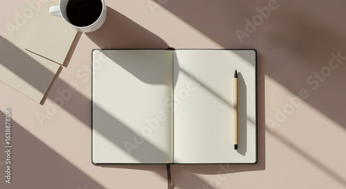 Stock photo of open notebook journal with coffee and pen for writing and planning