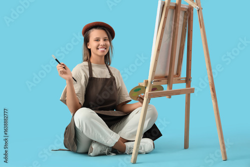 Young female artist with pa...