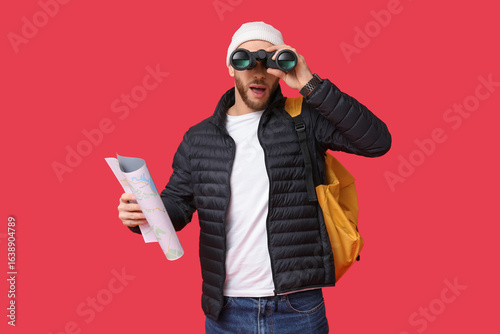 Young male tourist with bac...