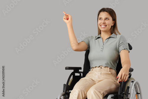 Young woman in wheelchair p...