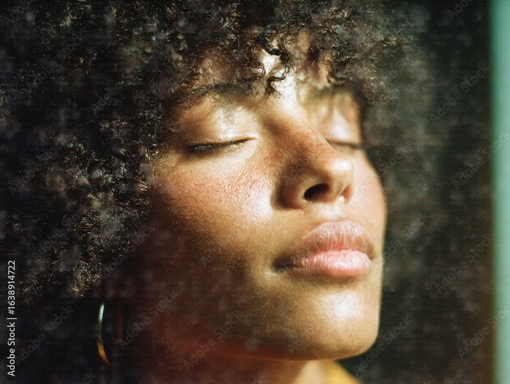 Fototapeta premium Authentic Young Woman with Natural Curly Hair Relaxing Calmly Premium Modern Lifestyle Portrait for Wellness and Mindfulness Content