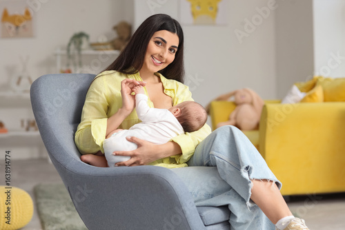 Woman breastfeeding her bab...