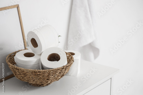 Wicker basket with rolls of...