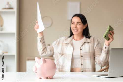 Piggy bank on table against...