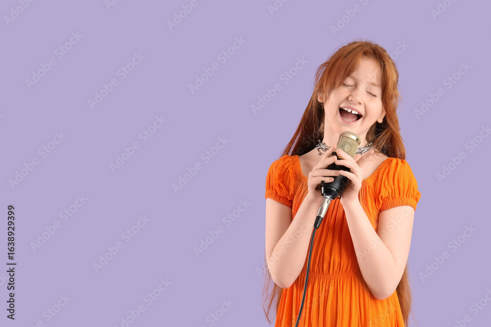 Obraz premium Teenage redhead girl with microphone singing karaoke on lilac background