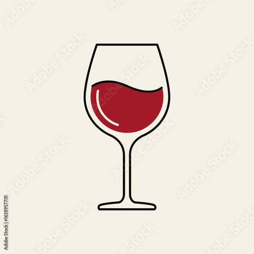 A glass of red wine on a light background.