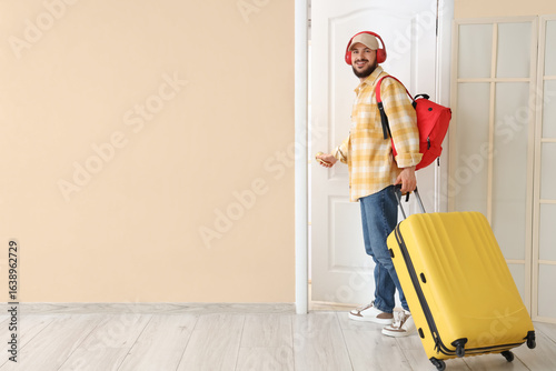 Male tourist with bags open...