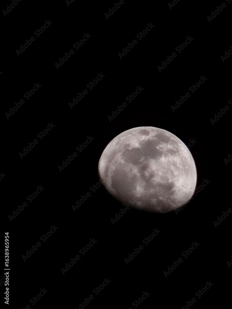 A celestial pearl, suspended in the velvet night. A celestial pearl, suspended in the velvet night.