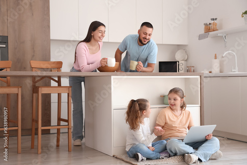 Happy parents and their dau...