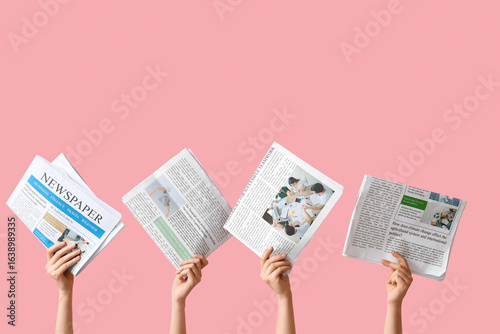 Female hands with newspaper...
