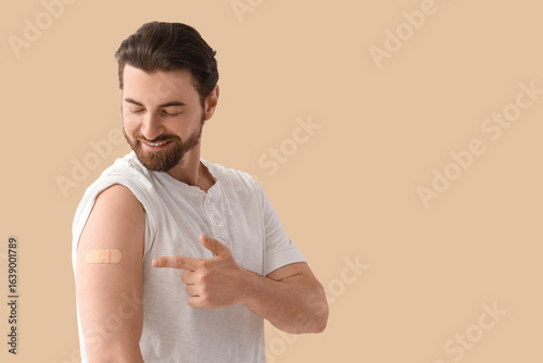 Young man pointing at appli...