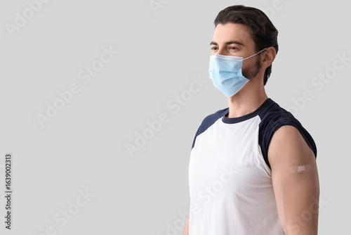 Man in medical mask with ba...