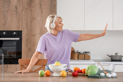 Happy mature woman with hea...
