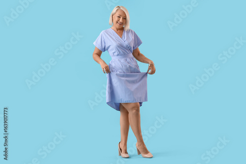 Happy mature woman dancing ...