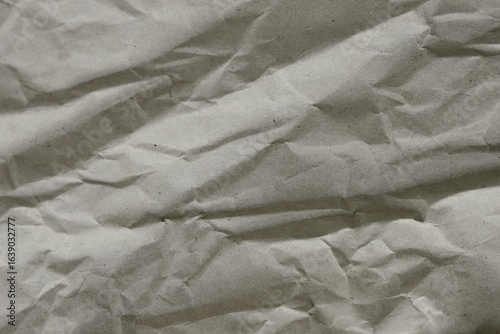 Brown crumpled recycled paper texture background. Kraft Paper