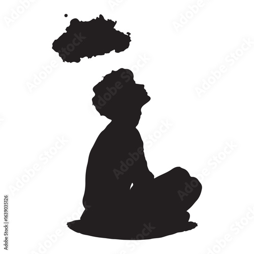 silhouette of sitting child looking up at the clouds