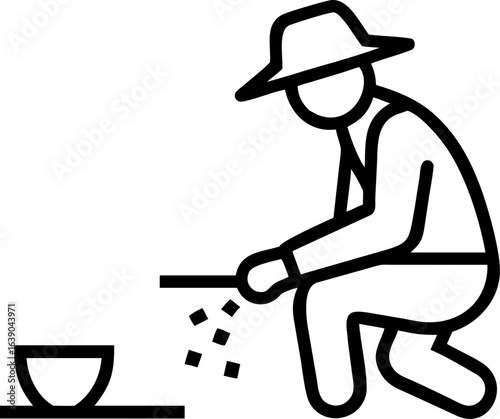 Farmer diligently planting seeds in a field symbolizing agriculture and growth