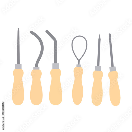 Clay sculpture tools arranged in neat row, essential artistry