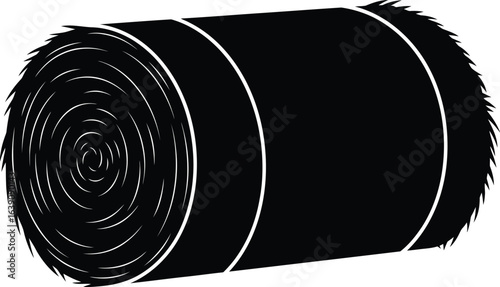 Black hay bale, a round straw roll for agriculture and farming, essential animal feed and livestock supply from harvested crop in rural countryside