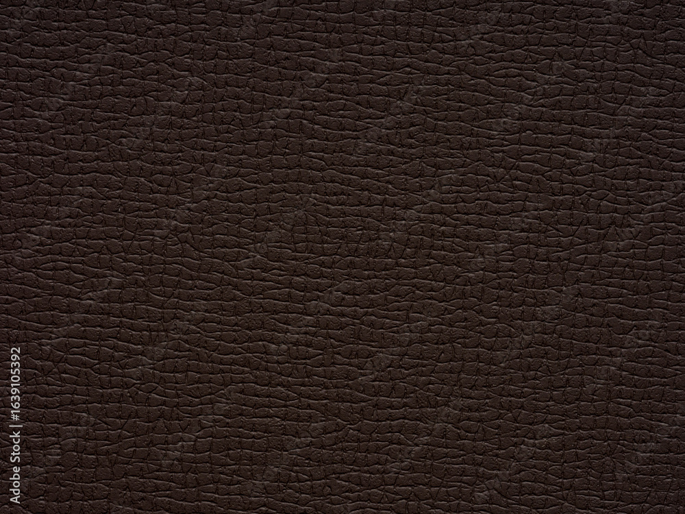 Fototapeta premium A rugged landscape of texture, the dark paper evokes the essence of earth's raw beauty