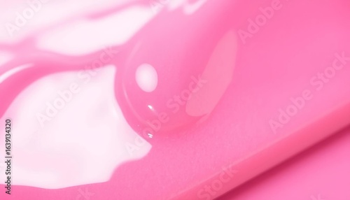 Close-up of glossy pink lipgloss, smooth texture, isolated,  lip gloss,   lip balm
