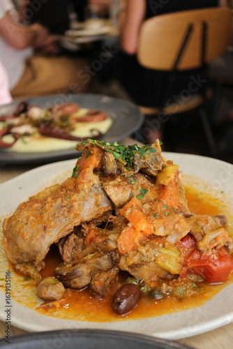 Maltese cuisine: stuffat tal-fenek (traditional Maltese stewed rabbit) in Valletta, Malta