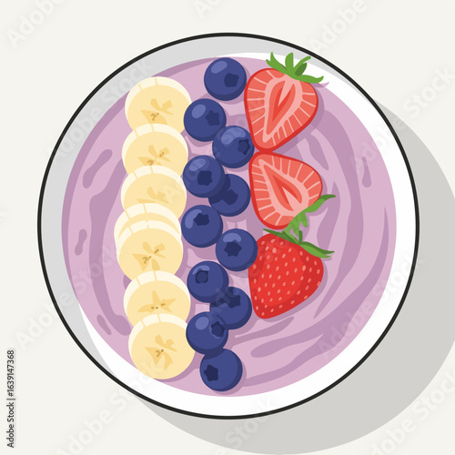 Smoothie bowl with fresh berries and sliced bananas displayed on white surface. Healthy smoothie bowl includes colorful and juicy ingredients for nutritious eating.