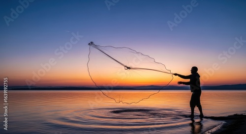 Wallpaper Mural Fisherman Silhouetted Against Vibrant Sunset, Casting Net into Calm Lake Waters Torontodigital.ca