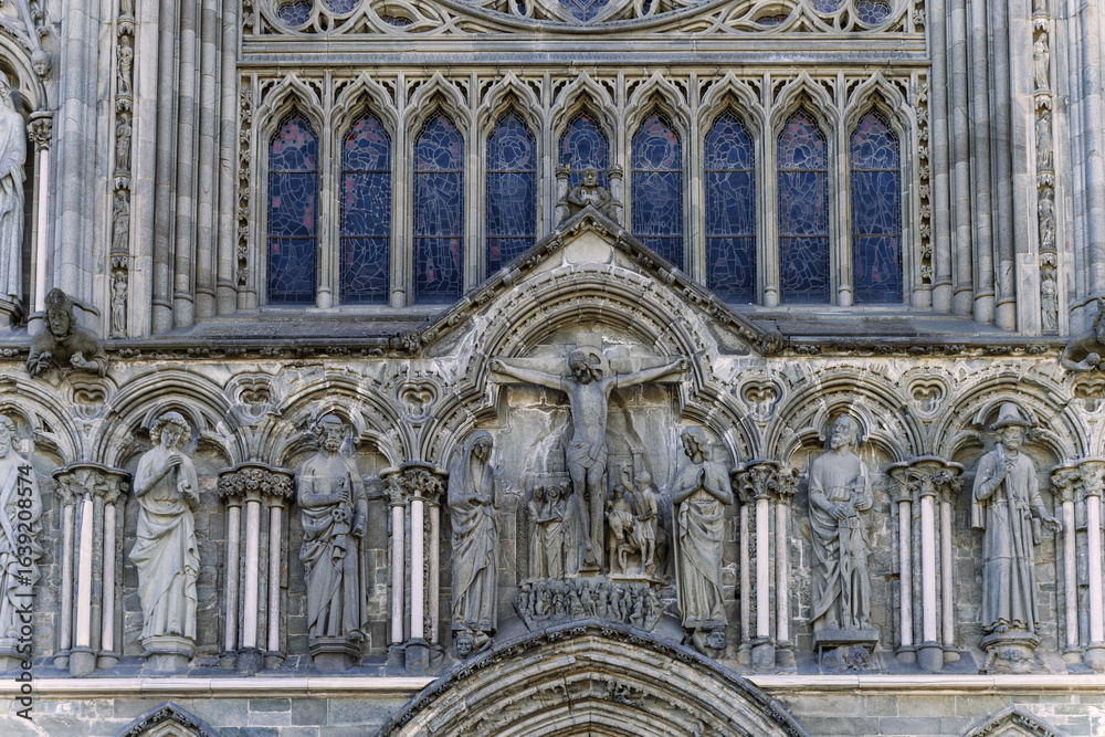 Fototapeta premium Grand Gothic Cathedral Architecture with Sunlight on a Clear Blue Sky, Nidaros, Trondheim, Norway