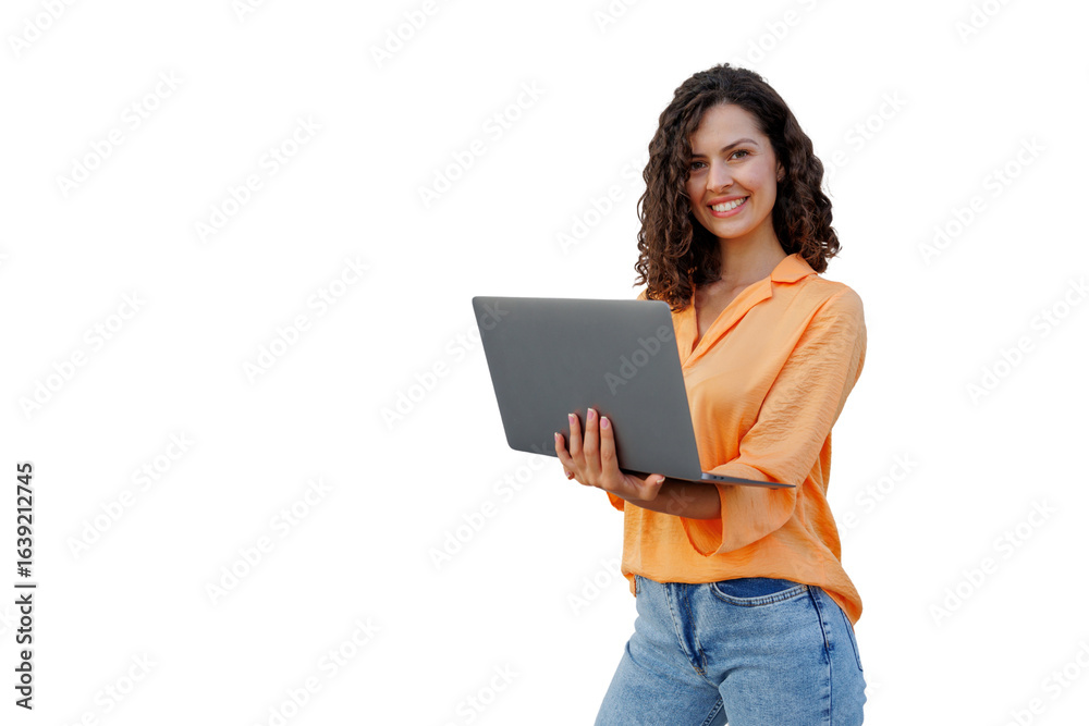 Naklejka premium Professional businesswoman smiling, gripping laptop while standing against transparent background, ideal for digital compositions