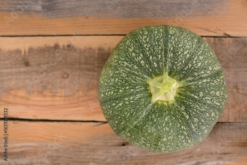 yellow pumpkin on wooden table