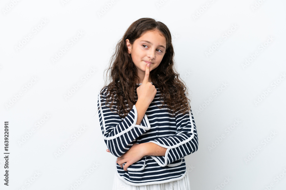 Little caucasian girl isolated on white background having doubts while looking up Little caucasian girl isolated on white background having doubts while looking up