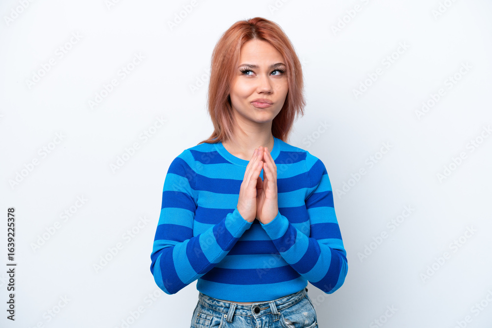 Fototapeta premium Young Russian girl isolated on white background scheming something